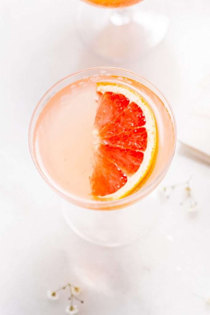 Spring grapefruit French 75 cocktail recipe with just four ingredients inlcluding gin and champagne. Easy and refreshing!