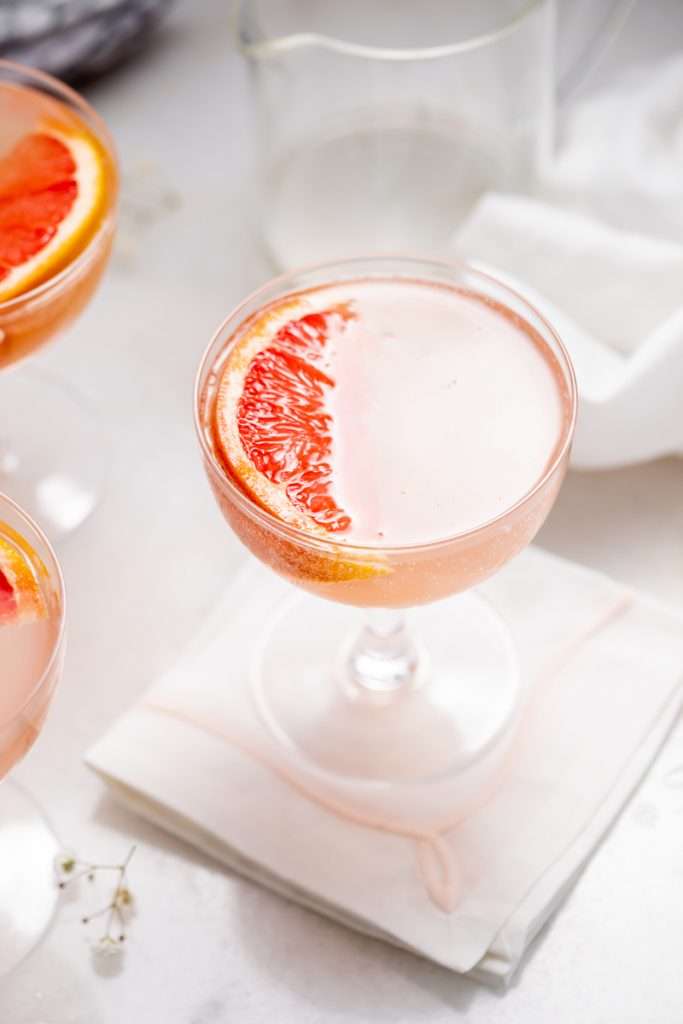 Spring grapefruit French 75 cocktail recipe with just four ingredients inlcluding gin and champagne. Easy and refreshing!