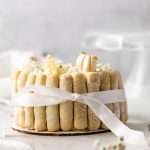 A bright and cheery lemon Charlotte cake, made with 4" macaron shells in place of sponge. Filled with lemon frosting and lemon curd. Dairy and gluten free.