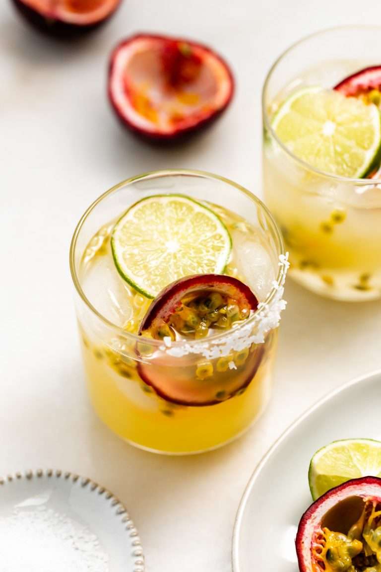 5 ingredient passion fruit margaritas made with fresh passion fruit and served on the rocks. Perfect for spring and summer entertaining.