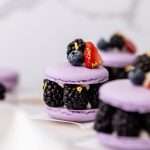 Laduree inspired summer French macarons filled with fresh blackberries and blueberries and lime filling. A dairy and gluten free variation perfect for seasonal gatherings and dessert menus.