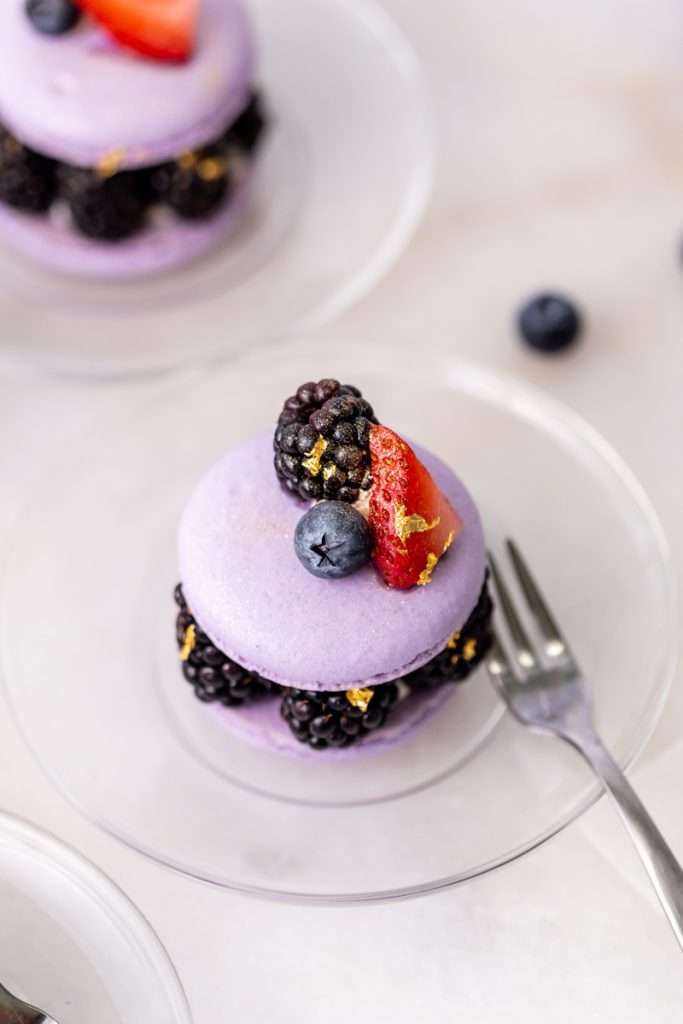 Laduree inspired summer French macarons filled with fresh blackberries and blueberries and lime filling. A dairy and gluten free variation perfect for seasonal gatherings and dessert menus.