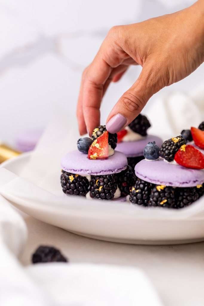 Laduree inspired summer French macarons filled with fresh blackberries and blueberries and lime filling. A dairy and gluten free variation perfect for seasonal gatherings and dessert menus.