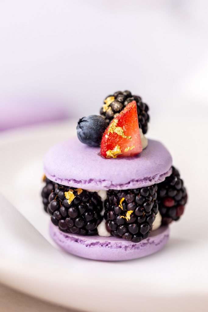 Laduree inspired summer French macarons filled with fresh blackberries and blueberries and lime filling. A dairy and gluten free variation perfect for seasonal gatherings and dessert menus.