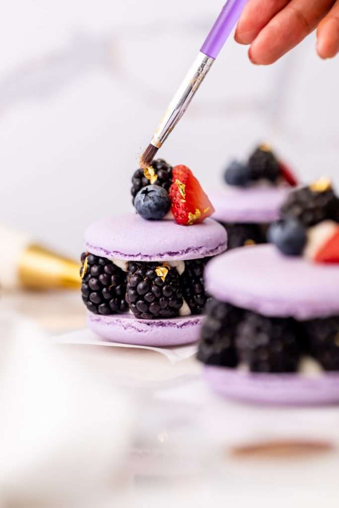 Laduree inspired summer French macarons filled with fresh blackberries and blueberries and lime filling. A dairy and gluten free variation perfect for seasonal gatherings and dessert menus.