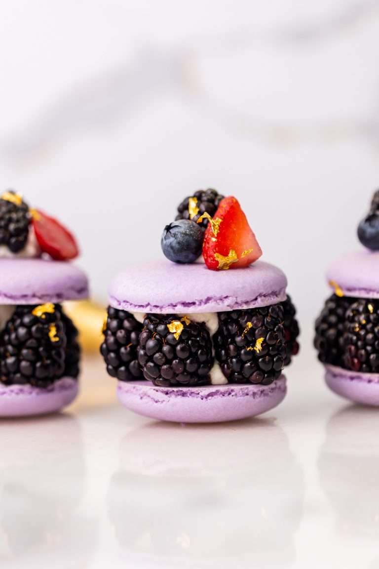 Laduree inspired summer French macarons filled with fresh blackberries and blueberries and lime filling. A dairy and gluten free variation perfect for seasonal gatherings and dessert menus.