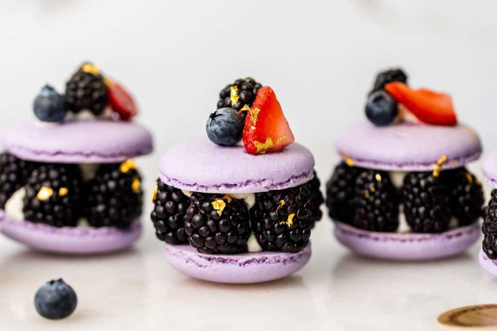 Laduree inspired summer French macarons filled with fresh blackberries and blueberries and lime filling. A dairy and gluten free variation perfect for seasonal gatherings and dessert menus.