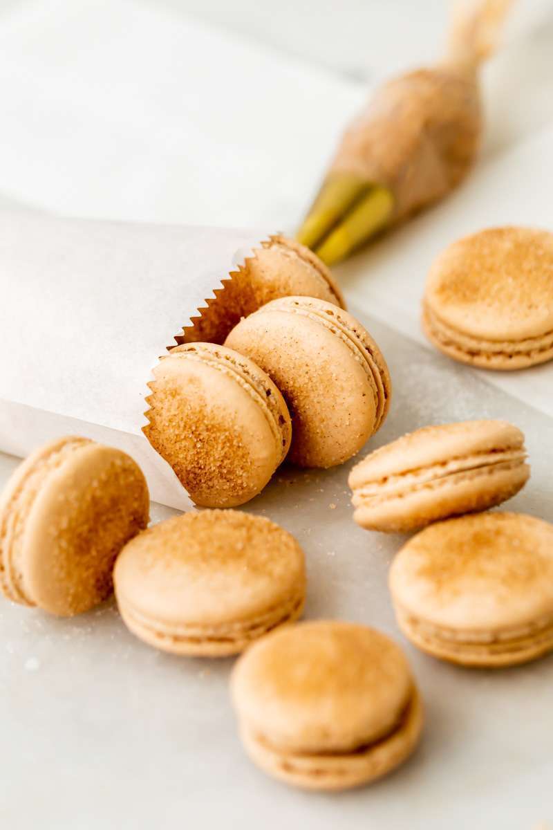 Churro flavored French macarons baked with cinnamon and sugar and filled with cinnamon flavored frosting. Dairy and gluten free