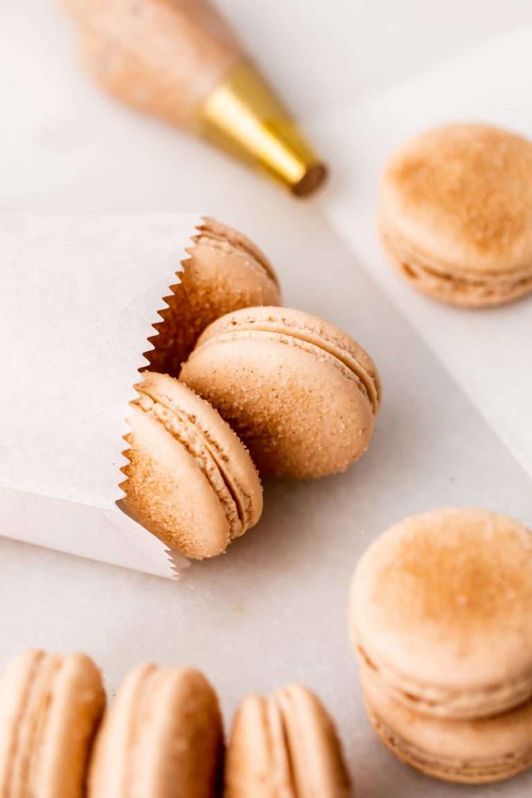Churro flavored French macarons baked with cinnamon and sugar and filled with cinnamon flavored frosting. Dairy and gluten free