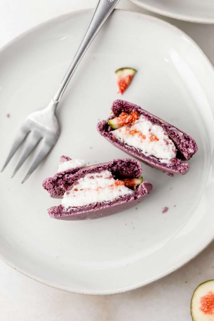 Fresh fig and vanilla bean French macarons. A delicious flavor combination for the fall season! Perfect for autumn celebrations and gatherings. Recipe and assembly video.