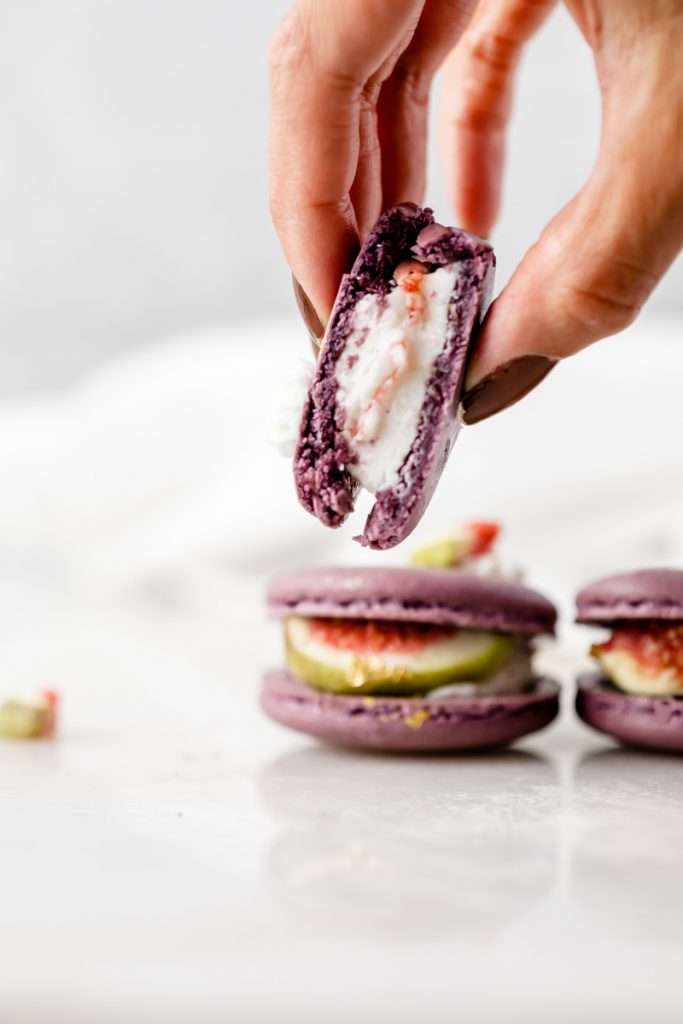 Fresh fig and vanilla bean French macarons. A delicious flavor combination for the fall season! Perfect for autumn celebrations and gatherings. Recipe and assembly video.