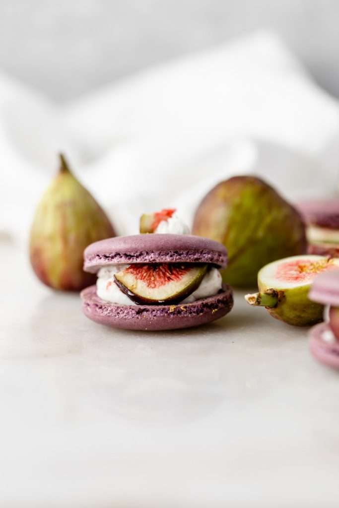 Fresh fig and vanilla bean French macarons. A delicious flavor combination for the fall season! Perfect for autumn celebrations and gatherings. Recipe and assembly video.