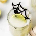 A quick and easy smoked margarita recipe perfect for halloween, made with mezcal and served on the rocks!