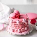 Marie Antoinette ispahan inspired macaron cake with fresh raspberries, raspberry rose frosting and royal icing decorations. The perfect party treat with recipe and video!