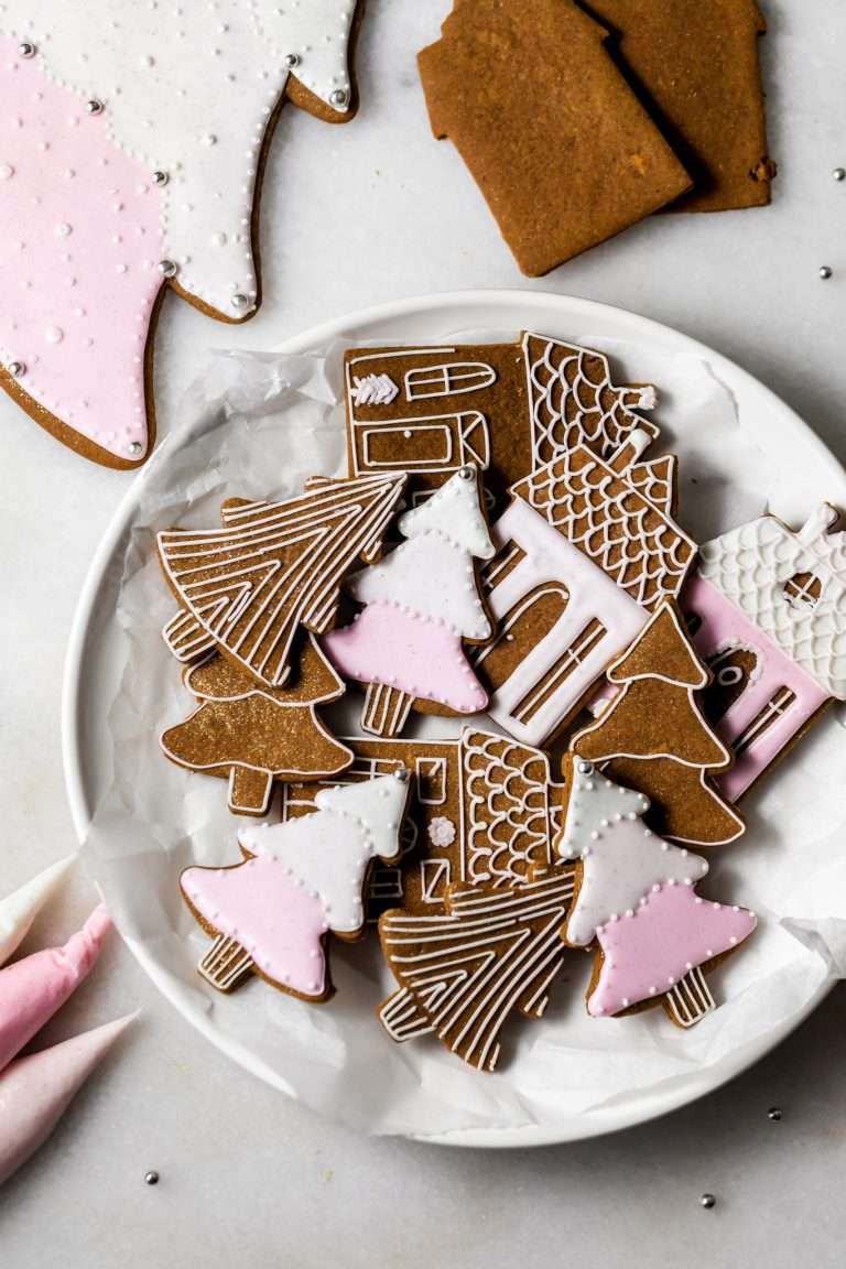 Soft gingerbread cookies decorated with shades of pink royal icing. Dairy Free and a wonderful recipe for Christmas and the holiday season!