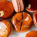 Créme brûlée macarons recipe inspired by trendy crème brûlée donuts, complete with a creamy vanilla custard center and a crisp caramelized sugar dipped shell. A dairy free and gluten free macaron recipe. Enjoy with tea, coffee, or champagne!