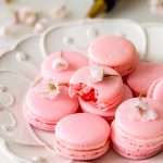 Spring macaron recipe filled with Sakura cherry blossom frosting and a fresh strawberry center. Dairy Free, Gluten Free and the perfect macaron and treat for spring.