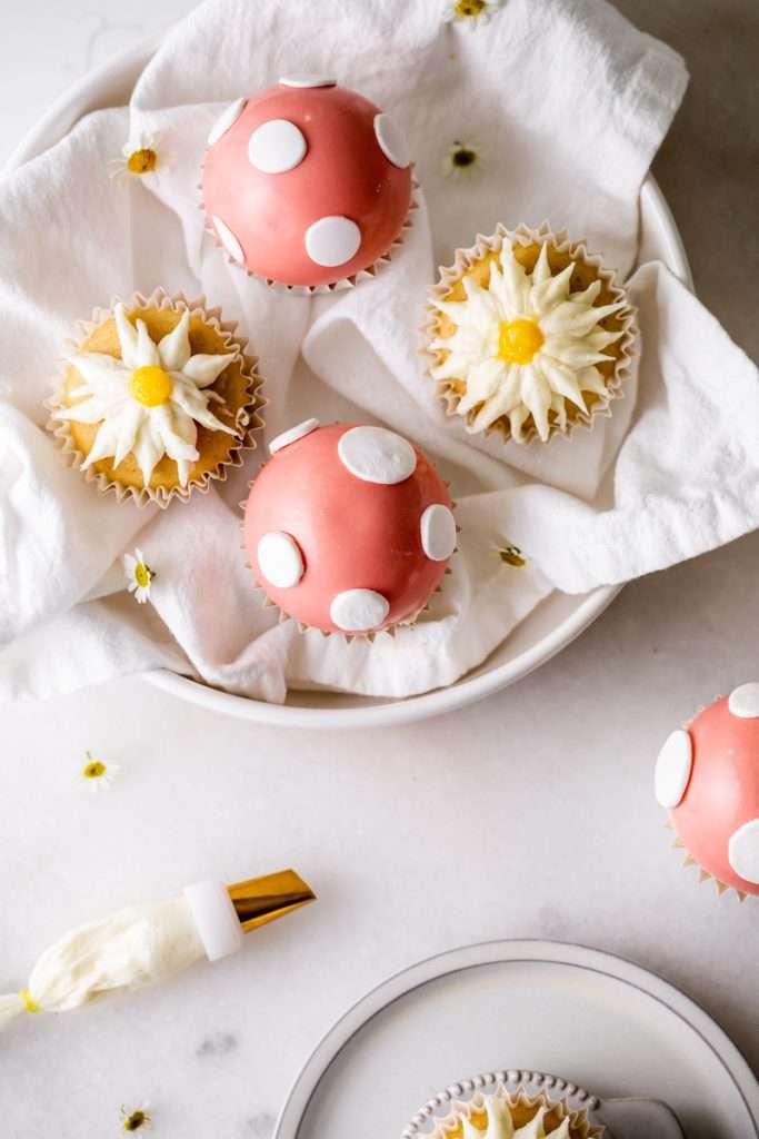 An easy tutorial and recipe for mushroom cap and daisy decorated cupcakes, perfect for kids party themes and seasonal celebrations. Dairy Free