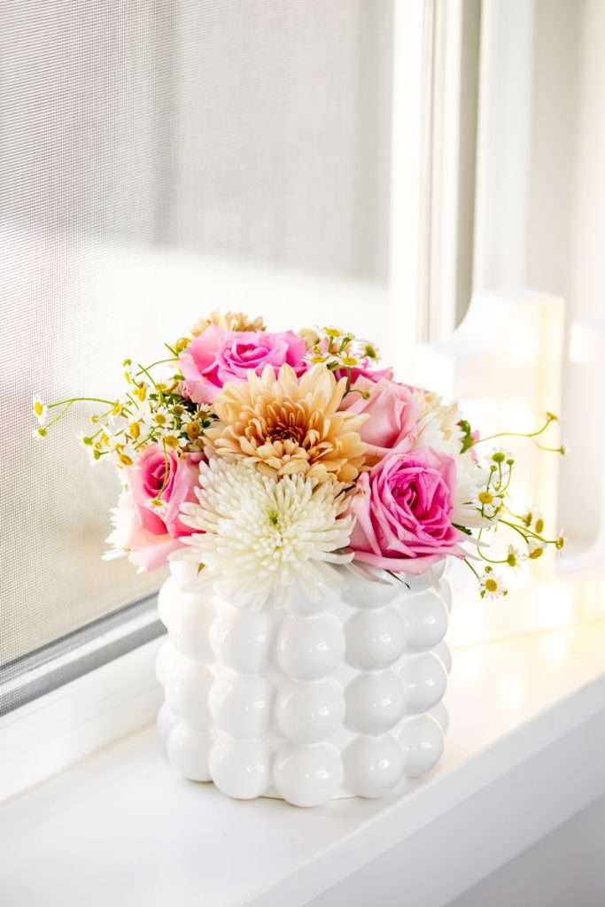 Flowers for kids retro themed birthday party with roses, mums and chamomile.