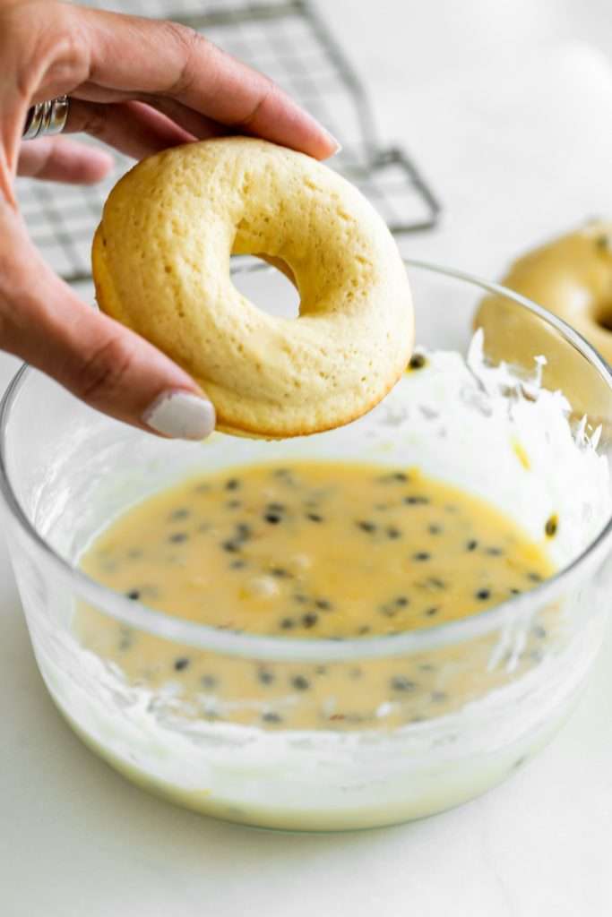 Light and fluffy small batch cake donuts covered in passion fruit glaze. Dairy free and baked not fried.