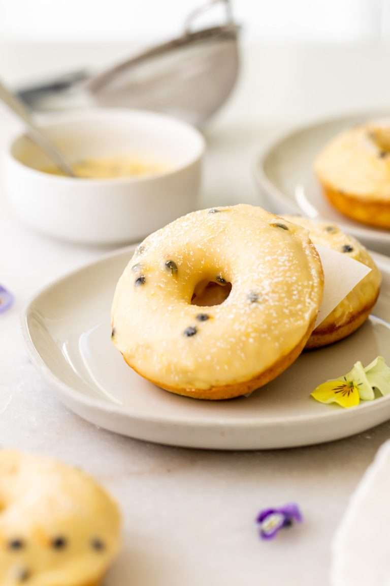 Light and fluffy small batch cake donuts covered in passionfruit glaze. Dairy free and baked not fried.