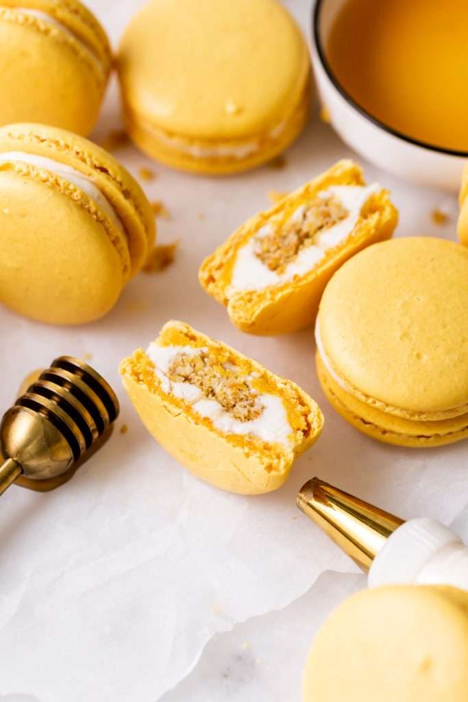 Southern inspired honey cornbread macarons, filled with honey sweetened frosting and a savory cornbread center, for Juneteenth!