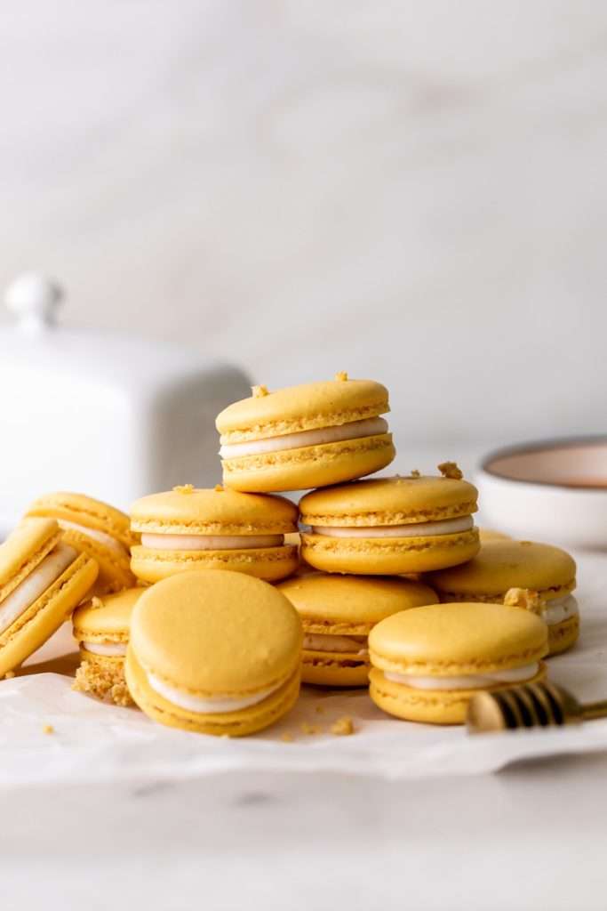 Southern inspired honey cornbread macarons, filled with honey sweetened frosting and a savory cornbread center, for Juneteenth!