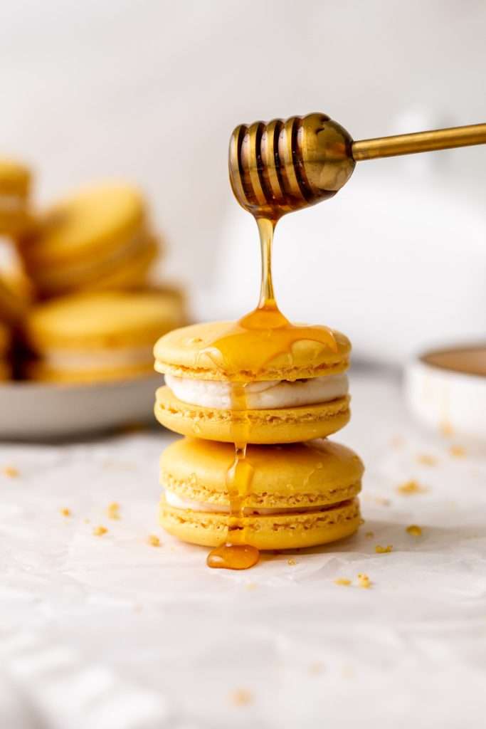 Southern inspired honey cornbread macarons, filled with honey sweetened frosting and a savory cornbread center, for Juneteenth!