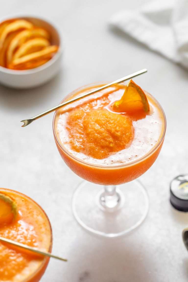 Just 4 ingredients is all you'll need to make a frozen Aperol spritz, complete with fresh oranges, Aperol and Prosecco. A simple and frosty cocktail to make before summer comes to a close!