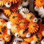 Cute chocolate cutout sugar cookies, decorated with easy pumpkin patch icing decorations. They're soft and delicious and perfect for fall gatherings, with a dairy free option included!