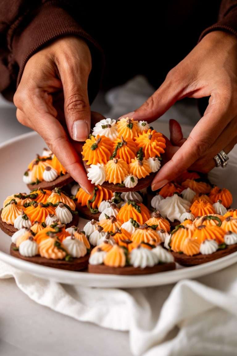 Cute chocolate cutout sugar cookies, decorated with easy pumpkin patch icing decorations. They're soft and delicious and perfect for fall gatherings, with a dairy free option included!