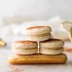 Tiramisu flavored macarons, with a tangy mascarpone filling and coffee soaked ladyfinger center. Decorated with a light dusting of cocoa powder to mimic the look of tiramisu. 