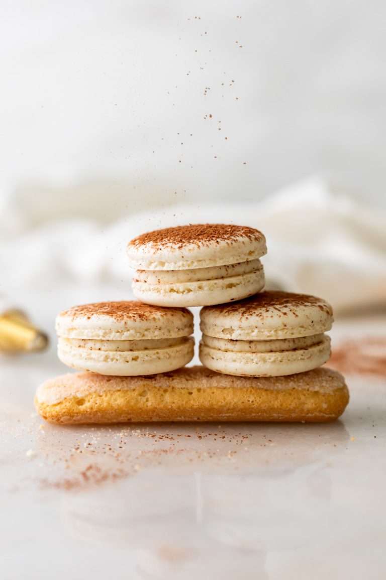 Tiramisu flavored macarons, with a tangy mascarpone filling and coffee soaked ladyfinger center. Decorated with a light dusting of cocoa powder to mimic the look of tiramisu. 
