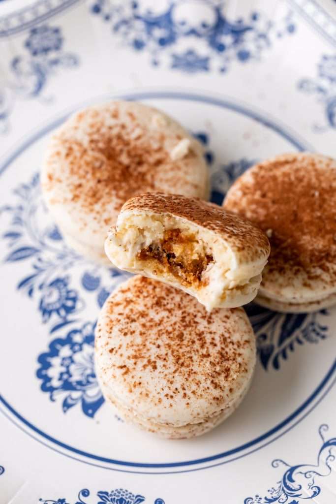 Tiramisu flavored macarons, with a tangy mascarpone filling and coffee soaked ladyfinger center. Decorated with a light dusting of cocoa powder to mimic the look of tiramisu.&nbsp;