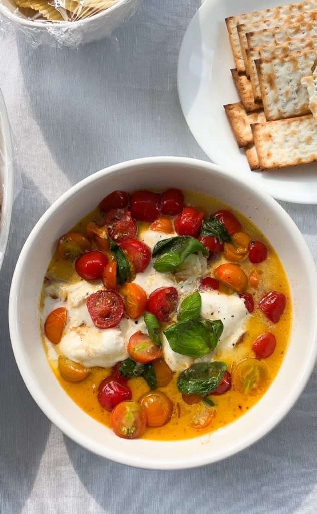 Buratta dip with fresh basil and tomatoes for Amalfi Coast themed dinner party.