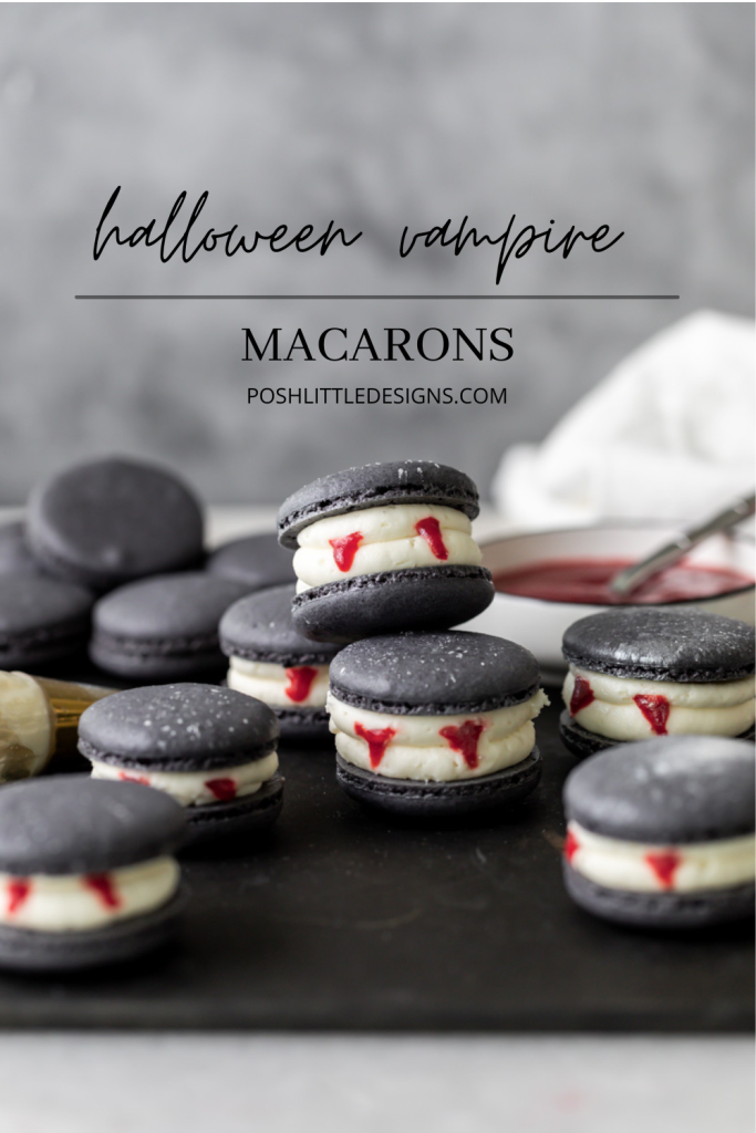 Easy Vampire decorated macarons for Halloween, with black cocoa shells, vanilla bean frosting and strawberry jam. A spooky sweet macaron for the fall season! Dairy free & Gluten free