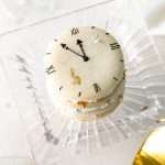 Chocolate hazelnut macaron cake decorated with a Roman numeral clock design for New Years Eve. Dairy Free & Gluten Free. Recipe & Tutorial.