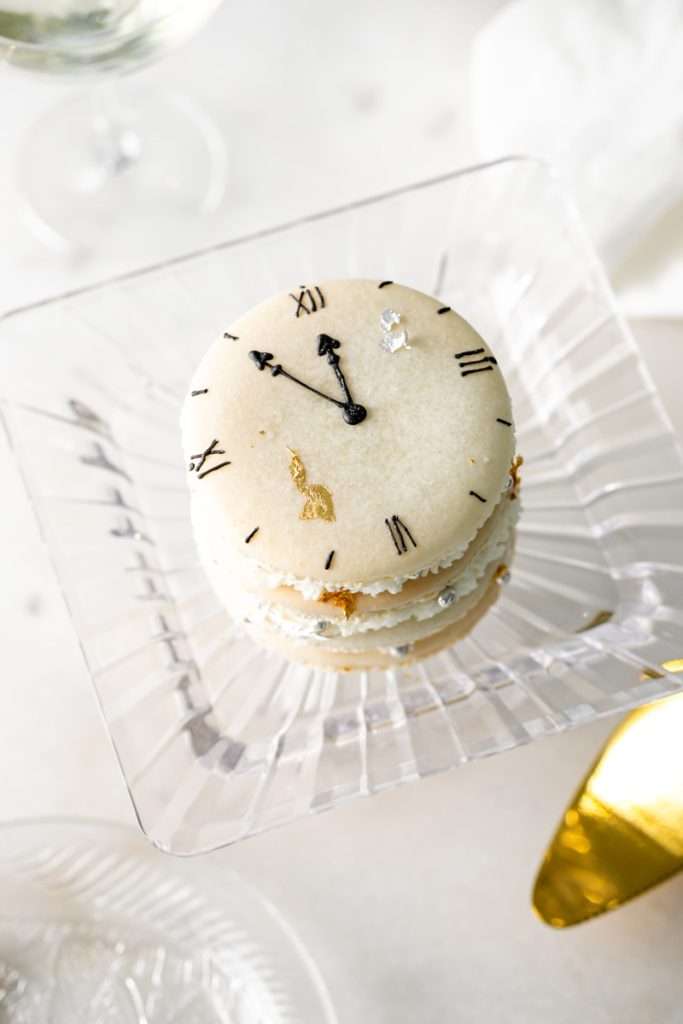 Chocolate hazelnut macaron cake decorated with a Roman numeral clock design for New Years Eve. Dairy Free & Gluten Free. Recipe & Tutorial.