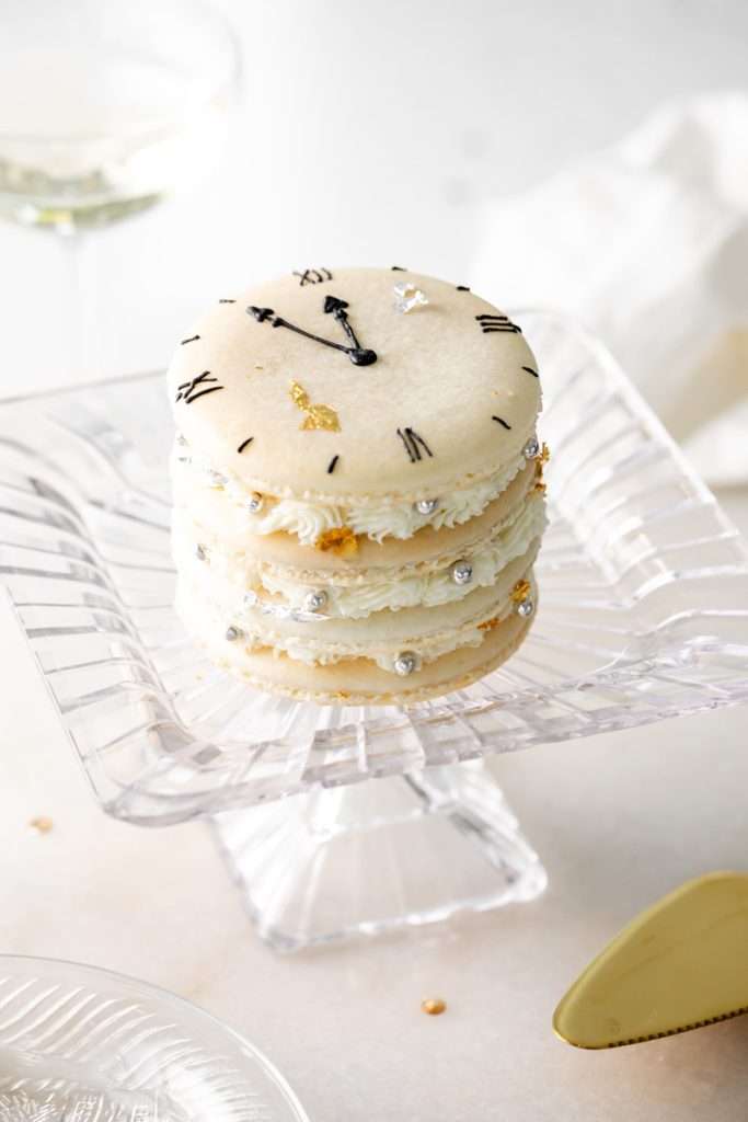 Chocolate hazelnut macaron cake decorated with a Roman numeral clock design for New Years Eve. Dairy Free & Gluten Free. Recipe & Tutorial.