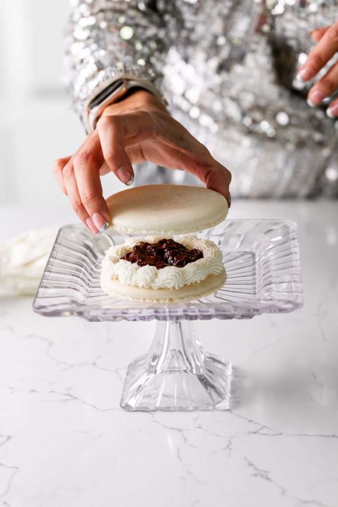 Chocolate hazelnut macaron cake decorated with a Roman numeral clock design for New Years Eve. Dairy Free & Gluten Free. Recipe & Tutorial.