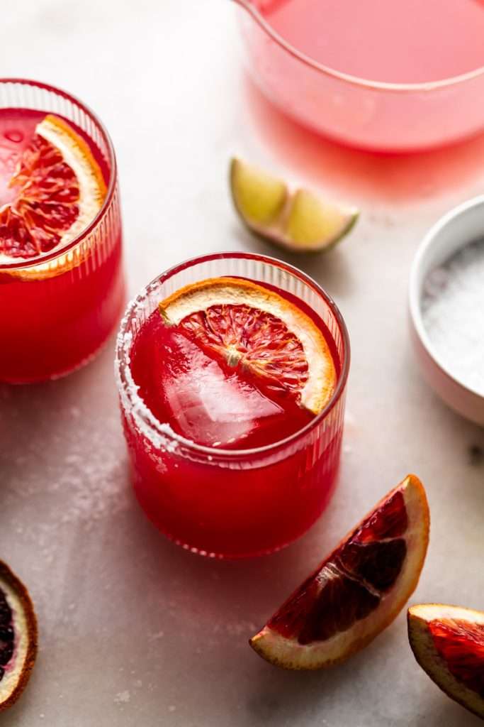 These blood orange margaritas are a vibrant and refreshing seasonal twist on the classic margarita, complete with fresh blood orange juice and only 5 other ingredients. The perfect cocktail recipe as we transition from winter to spring!