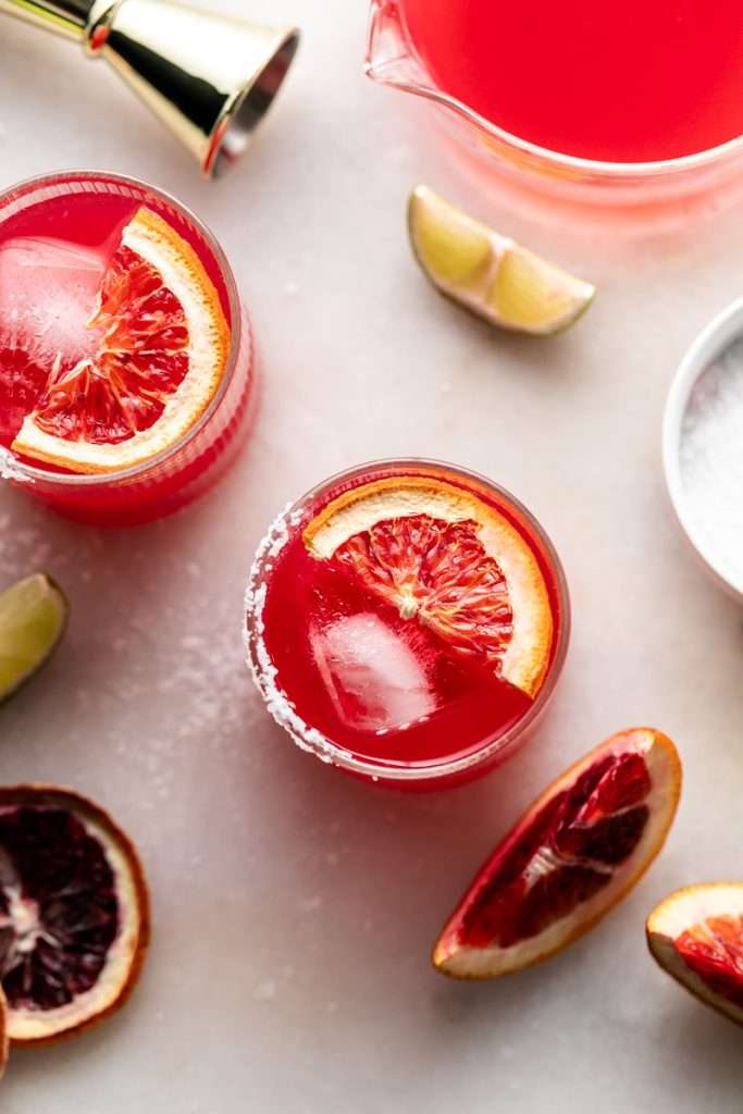 These blood orange margaritas are a vibrant and refreshing seasonal twist on the classic margarita, complete with fresh blood orange juice and only 5 other ingredients. The perfect cocktail recipe as we transition from winter to spring!