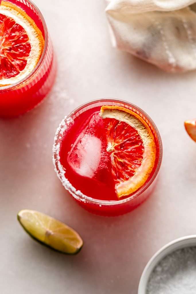 These blood orange margaritas are a vibrant and refreshing seasonal twist on the classic margarita, complete with fresh blood orange juice and only 5 other ingredients. The perfect cocktail recipe as we transition from winter to spring!