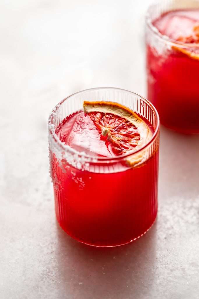 These blood orange margaritas are a vibrant and refreshing seasonal twist on the classic margarita, complete with fresh blood orange juice and only 5 other ingredients. The perfect cocktail recipe as we transition from winter to spring!