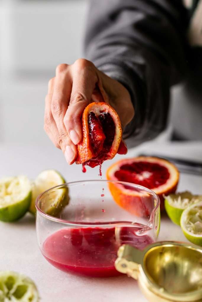 These blood orange margaritas are a vibrant and refreshing seasonal twist on the classic margarita, complete with fresh blood orange juice and only 5 other ingredients. The perfect cocktail recipe as we transition from winter to spring!
