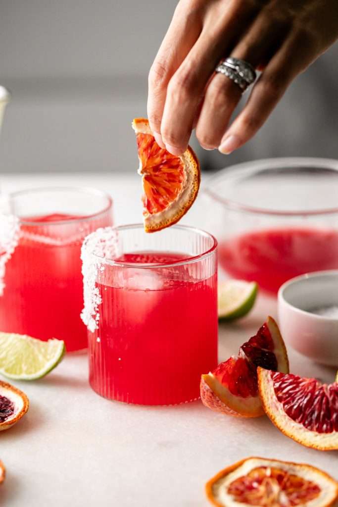 These blood orange margaritas are a vibrant and refreshing seasonal twist on the classic margarita, complete with fresh blood orange juice and only 5 other ingredients. The perfect cocktail recipe as we transition from winter to spring!