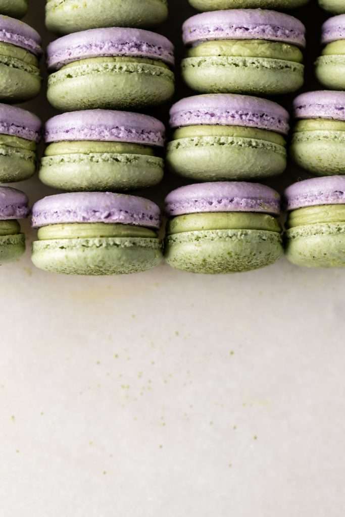 Indulge in a delicious lavender matcha macaron, inspired by the new Starbucks Lavender Matcha latte. From the earthy matcha frosting to the the delicate lavender chocolate ganache sandwiched between two tone almond macaron shells, they are not only delicious but perfect for your upcoming spring gatherings!