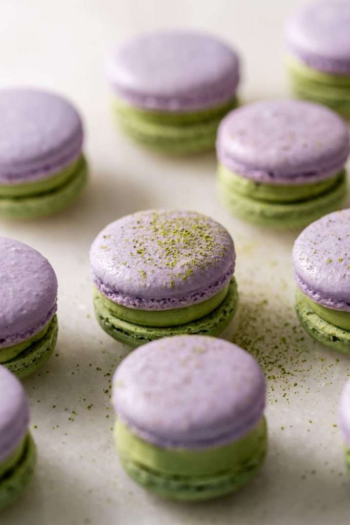 Indulge in a delicious lavender matcha macaron, inspired by the new Starbucks Lavender Matcha latte. From the earthy matcha frosting to the the delicate lavender chocolate ganache sandwiched between two tone almond macaron shells, they are not only delicious but perfect for your upcoming spring gatherings!