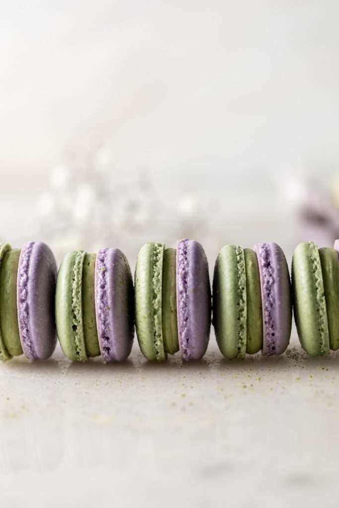 Indulge in a delicious lavender matcha macaron, inspired by the new Starbucks Lavender Matcha latte. From the earthy matcha frosting to the the delicate lavender chocolate ganache sandwiched between two tone almond macaron shells, they are not only delicious but perfect for your upcoming spring gatherings!