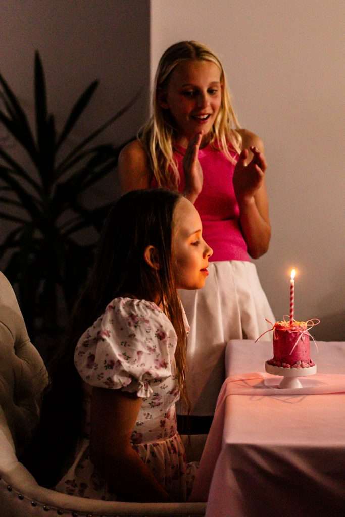 How to throw a Barbie Birthday Party, complete with pink Barbie decor, a life-size barbie box, custom barbie desserts, and details to highlight the iconic theme and movie. Links to all products shared in the post! #barbieparty #barbiemovie